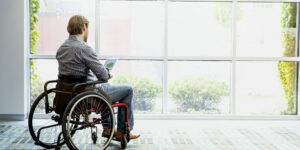Professional reviewing disability insurance policy for income protection with an advisor
